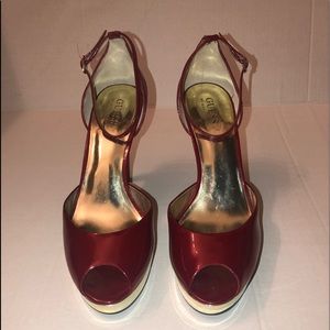 Red Guess peep toe heels with gold platform bottom. Size 9.